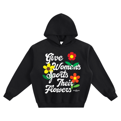 Black hoodie with 'Give Women's Sports Their Flowers' text and floral graphics on a white background